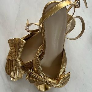 Gold bow heels. NEVER WORN!